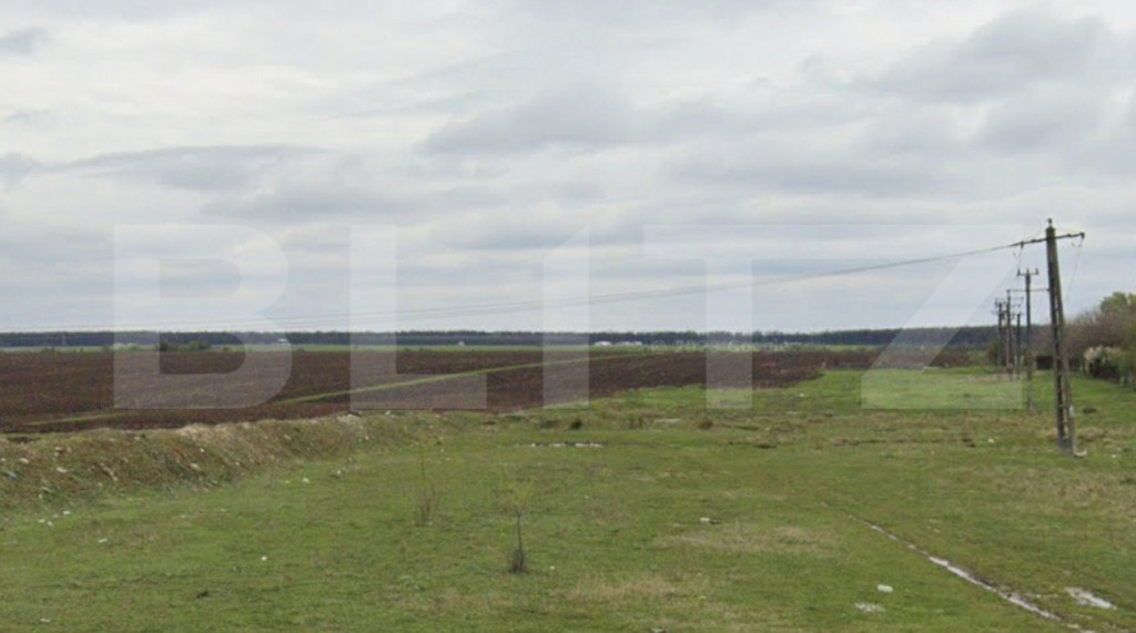 Teren intravilan industrial 9976 mp, deschidere dubla 23,7 m