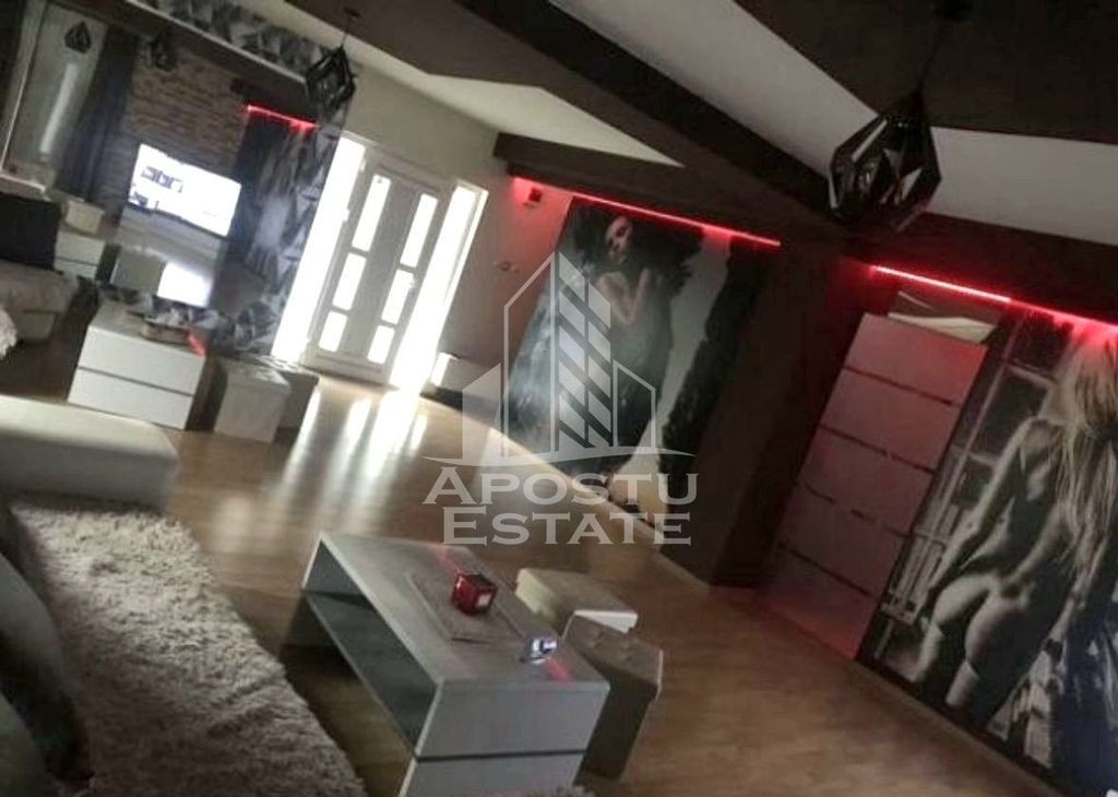 Casa individuala cu 7 camere si hala service,teren 600 mp...