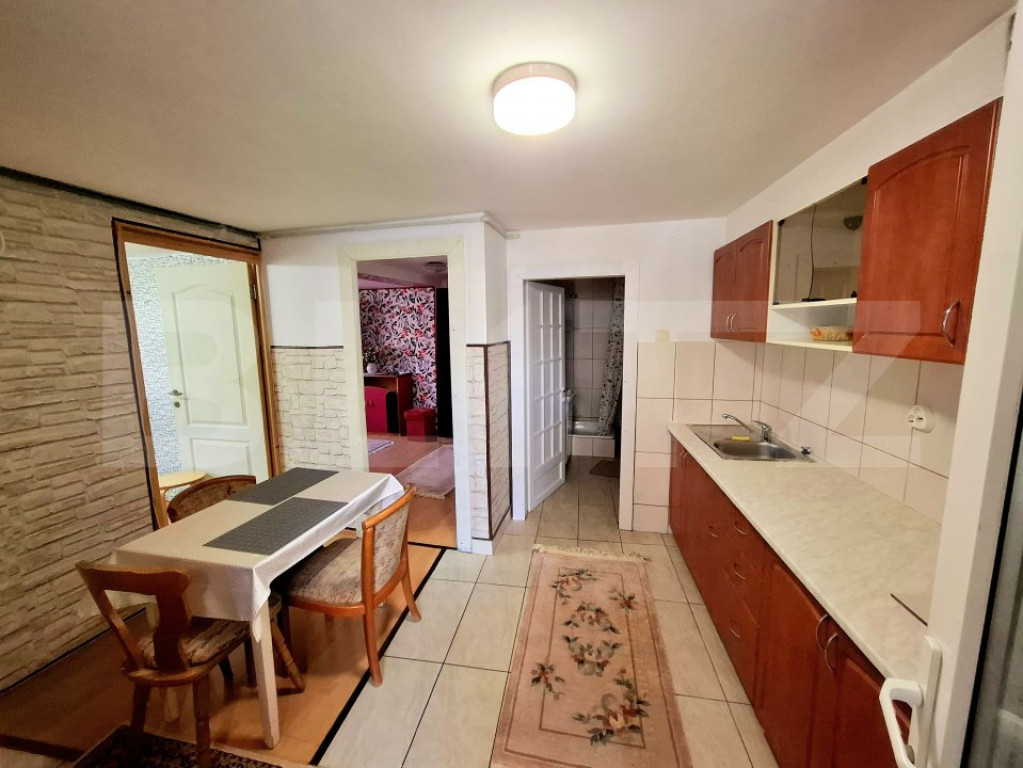 Casa cu 4 apartamente si curte proprie ,suprafata utila 122m