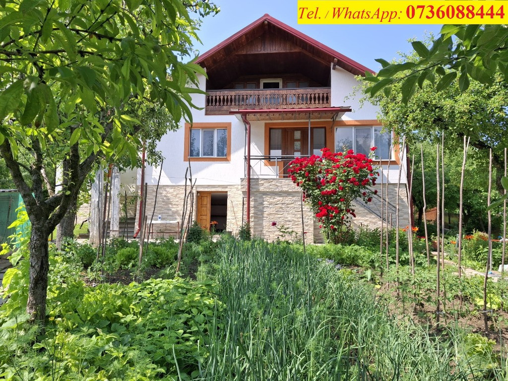 Casa 5 camere,util 112mp,beci,garaj,1200mp intravilan livada,Slanic