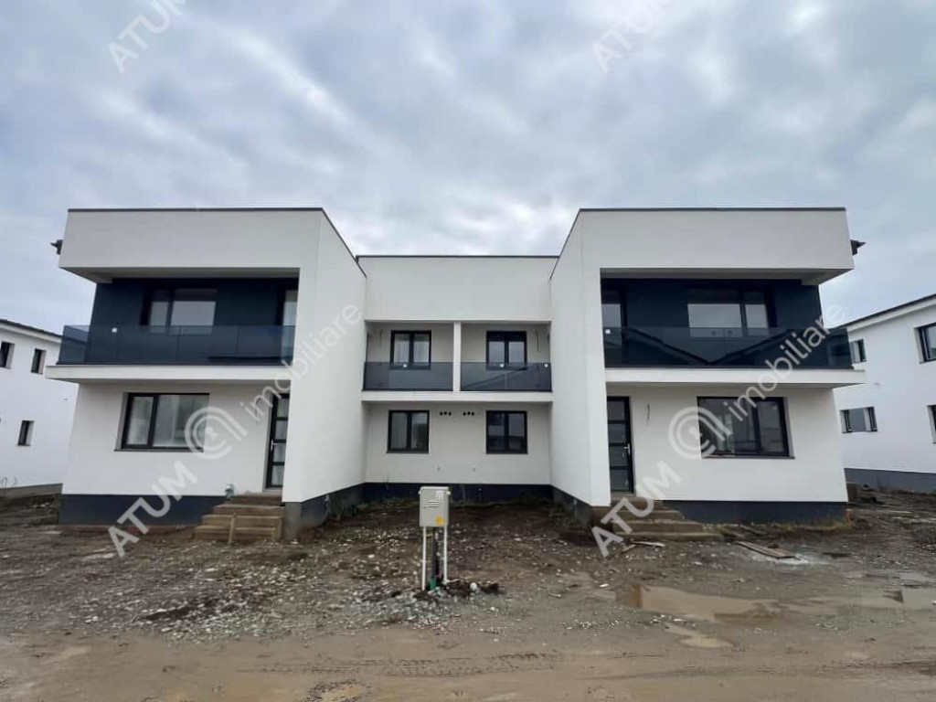 Casa cu 4 camere 2 bai curte de 50 mp zona Calea Cisnadiei S