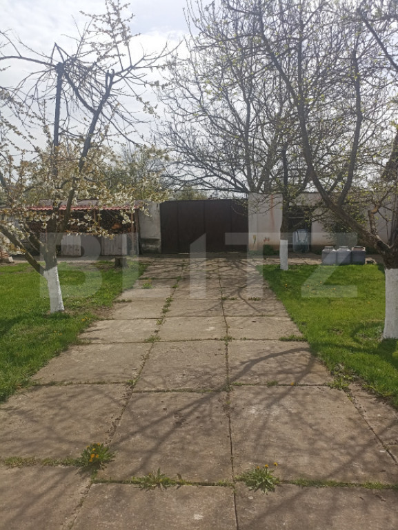 Casă de vânzare cu teren generos – la doar 15 minute de