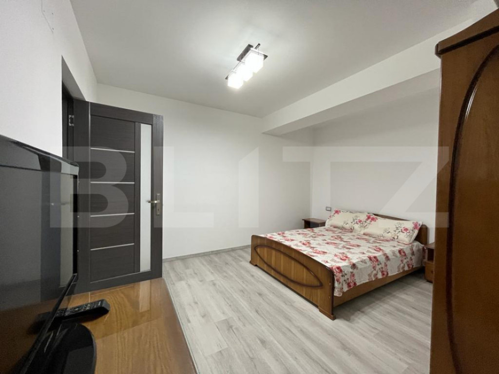 Apartament modern cu două camere, centrala si loc de parcar