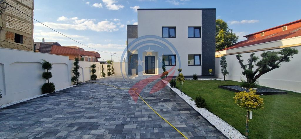 Casă modernă de lux – 4 camere, teren 373 mp, curte a...